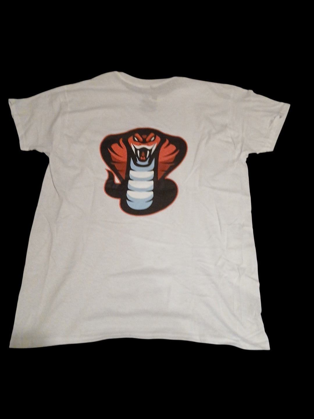 Venomous Volare white crewneck t-shirt featuring a detailed cobra graphic print on the back